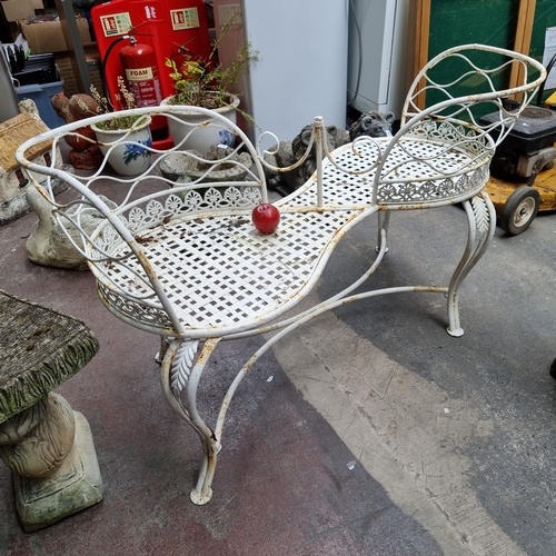 686 - A very attractive Victorian style wrought iron conversation bench, with beautiful pierced surround a... 