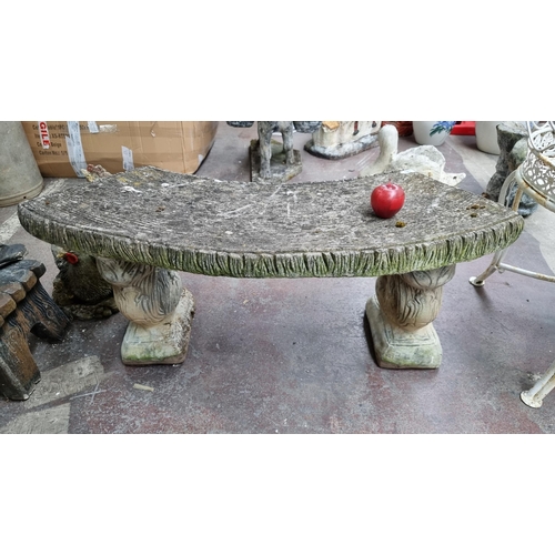 687 - A very heavy curved garden bench, supported by two charming squirrels.