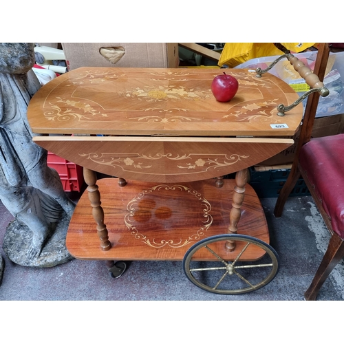 693 - A very lavish two-tiered Italian Sorrento drop leaf drinks trolley beautiful decorated with floral m... 