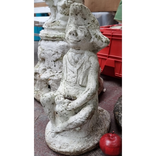 696 - A  very heavy garden statue in the form of a mischievous leprechaun in a rustic white finish.