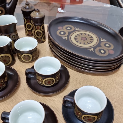 395 - A wonderful collection of thirty-seven pieces of mid-century Denby tableware in their iconic 