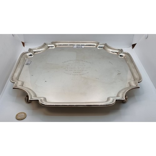 408 - Star Lot: A huge, very fine example of a sterling silver scroll footed presentation tray. This examp... 