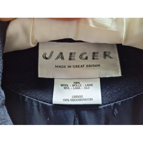 295 - An elegant 100% wool ladies coat in navy for Jaeger with wide lapels and a hammered metal buttons.(U... 