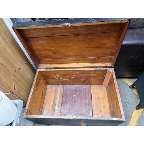 302 - A solid oak chest with locking front, cast metal sides and a brass plaque to top reading 