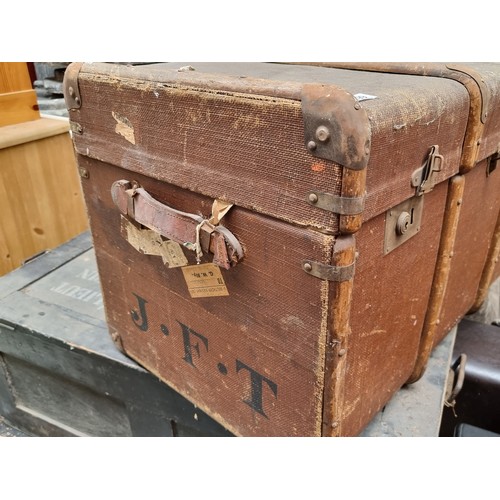 299 - A very large antique travelling trunk with canvas finish, bent wood supports and marked JFT to the s... 