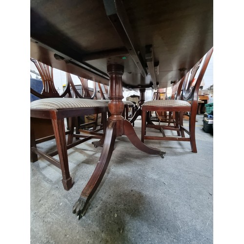 371 - Star lot : A beautiful dining suite comprising of an extendable dining table with brass scroll and s... 