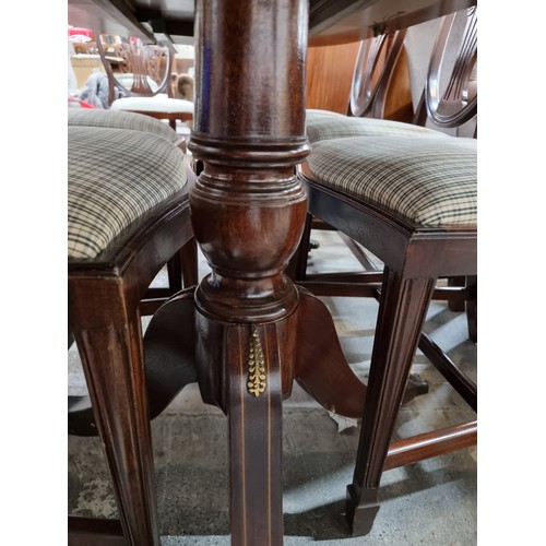 371 - Star lot : A beautiful dining suite comprising of an extendable dining table with brass scroll and s... 