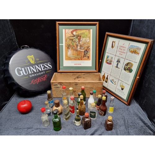 466 - A mixed lot of Guinness and alcohol related items including a  wall hanging Guinness cap sign, two p... 