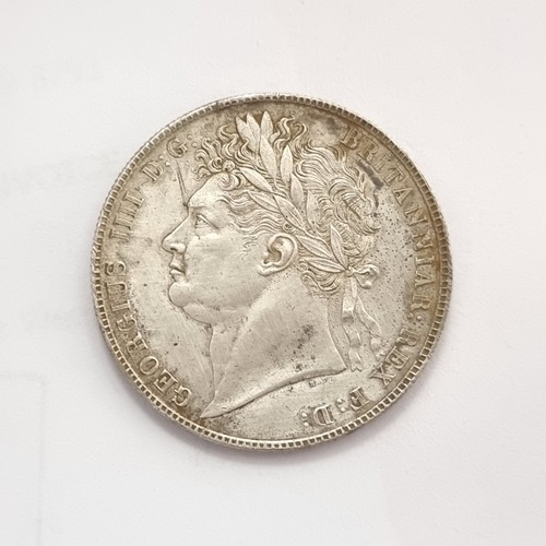 431 - A large rare silver George III coin, with profile facing to the left. Dated 1820.