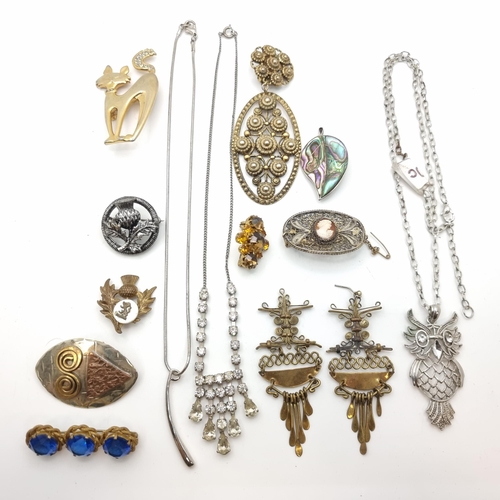 13 - An assorted collection of high quality vintage costume jewellery items, including three gem set pend... 
