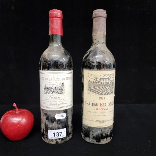 137 - Two bottles of sealed, vintage red wine. Including a 1983 Chateau Beauséjour Fronsac and a 1995 Chat... 