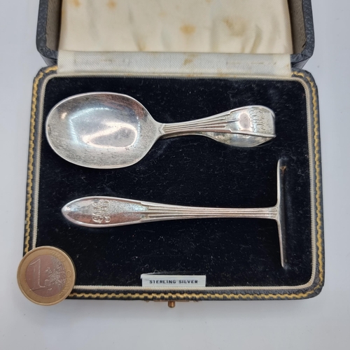 22 - A sterling silver antique pusher set, with the inscription 