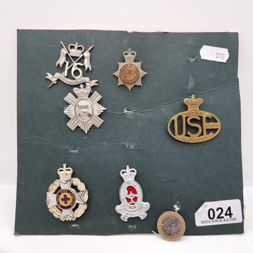 24 - A collection of six military badges, including a Queens Lancers example, A United Services Corps and... 