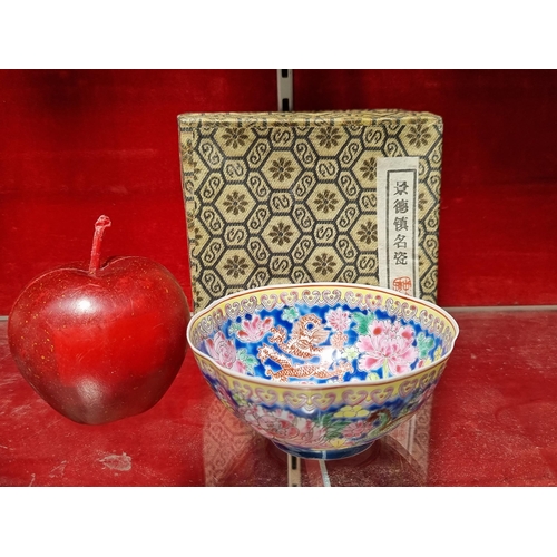 306 - A vintage Chinese famille rose porcelain tea bowl in VGC in original Silk lined box.