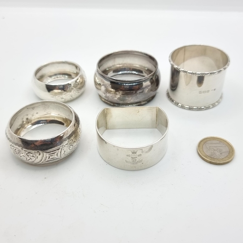 31 - A fantastic collection of seven assorted sterling silver napkin rings, hallmarks include Birmingham,... 
