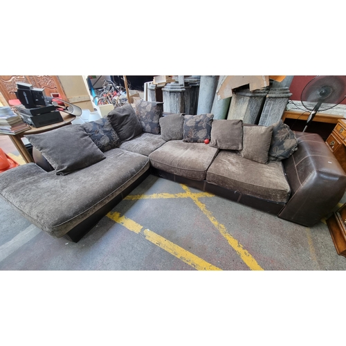 332 - A very large an comfortable plush corner couch (seats 5) with brown leather frame with saddle stitch... 