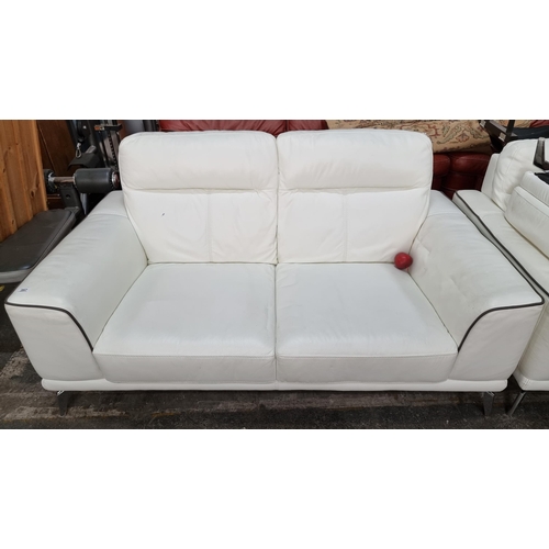 357 - Star lot : A fantastic white Italian leather two-seater sofa. A stylish comfortable example of loung... 