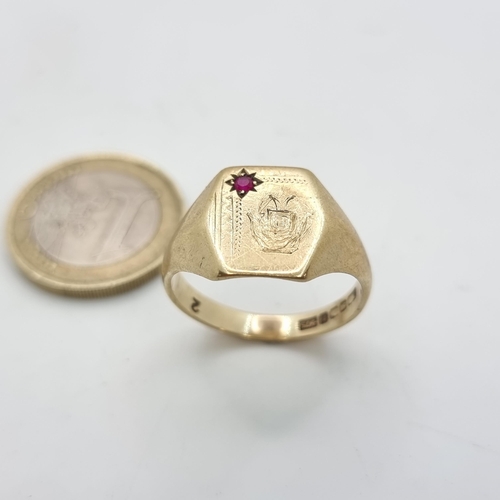 51 - A Gents 9ct gold signet ring, with a Ruby stone accent. Size U, weight: 5.15 grams.