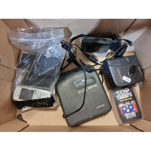 758 - A box with eleven electronic items from the early two thousands, including a Sony Walkman (Model Num... 