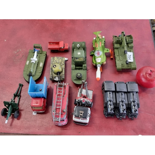 764 - A selection of fourteen model vehicles including examples by Dinky Toys, Matchbox and Corgi Major. I... 