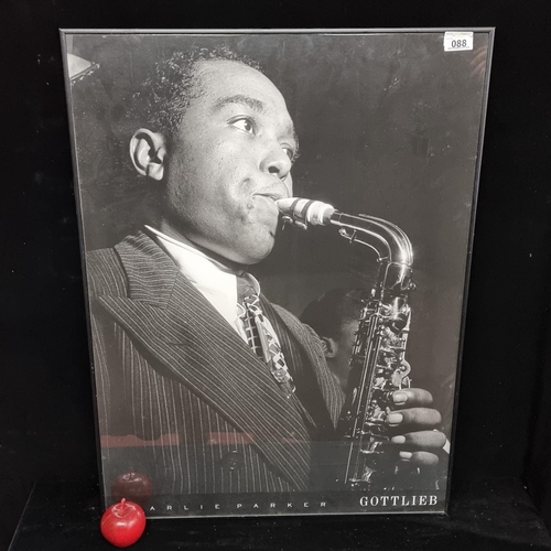 88 - A large framed black and white poster of the famous Jazz musician Charlie Parker.