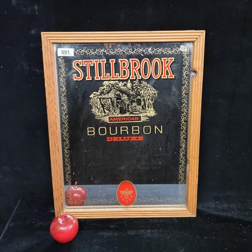 91 - An advertising mirror for Stillbrook bourbon in a wooden frame.