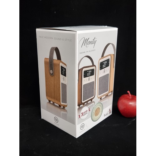 783 - A monty DAB/FM radio & bluetooth speaker in a stylish wood finish in original box, brand new never o... 