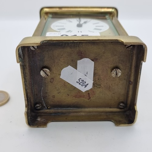 15 - A handsome example of an antique mechanical  French brass carriage clock, with original top carrier ... 