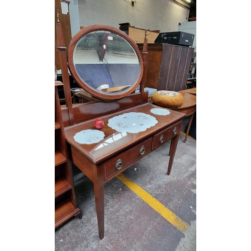 497 - A beautiful antique dressing table with oval bevelled mirror, brass finials and two drawers with dro... 