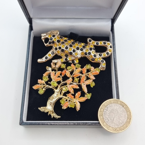 541 - Two high quality brooches, the first is a leopard example set with Citrine and Onyx stone detailing ... 