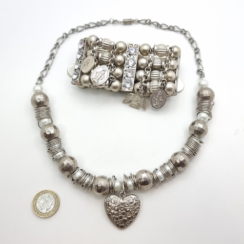 542 - An Indian drop pendant necklace, set with Pearl detailing. Together with a further Indian example of... 