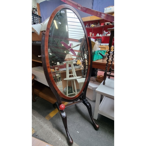 560 - A vey large EDWARDIAN cheval mirror with lovely curved lines throughout, conveniently set on casters... 