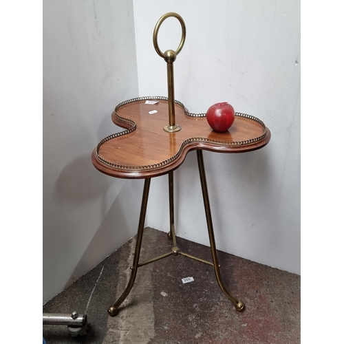 564 - A stunning antique 19th century mahogany clover tea table with pierced brass gallery surround, brass... 