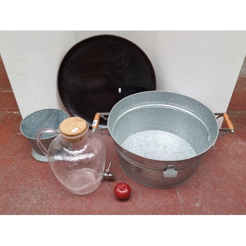 566 - A great lot of four entertaining items including a huge aluminium ice bucket with wooden handle and ... 