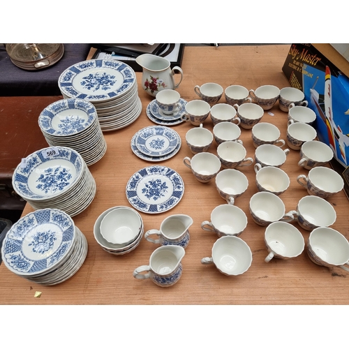 569 - 104 pieces of blue and white Myott ironstone in the melody pattern along with a Romanian made jug wi... 