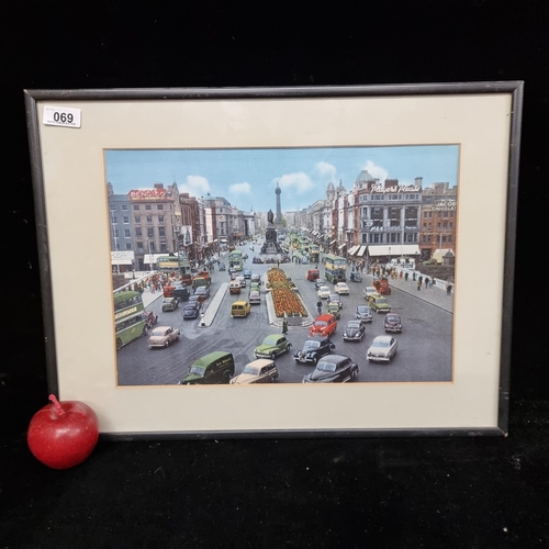 69 - A nice print of a photograph of 1950's O'Connell street, Dublin in lovely bright colours