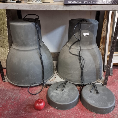 709 - A pair of incredibly large, industrial style dome shaped pendent shades. With black hanging chains.