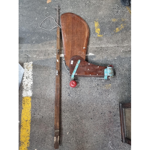 723 - A large, antique Sailboat rudder, carved from mahogany with fixtures intact.