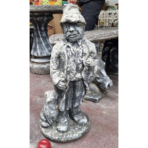 727 - A charming reconstituted stone and plaster garden statue of a country gentleman with cane and two do... 