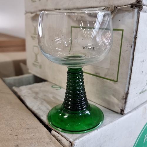 711 - A fantastic collection of glassware, including thirty-six stemmed glasses with pretty green bases. A... 