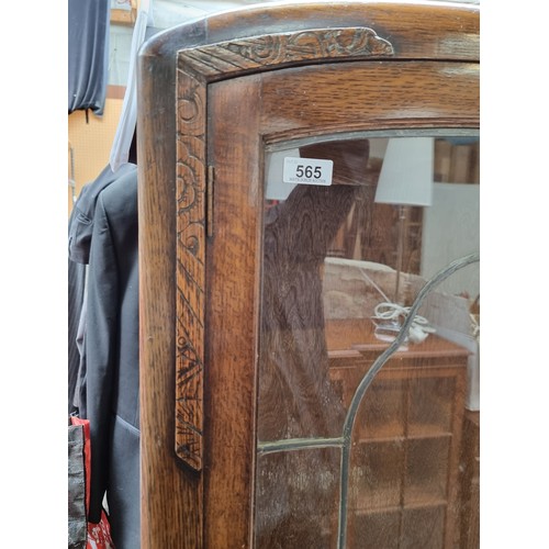 565 - A beautiful Art Deco  display case with glass fronted leaded doors, recessed panels, carved accents ... 