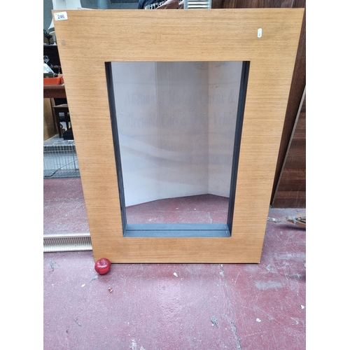 246 - A very large contemporary wall hanging mirror with a thick frame.