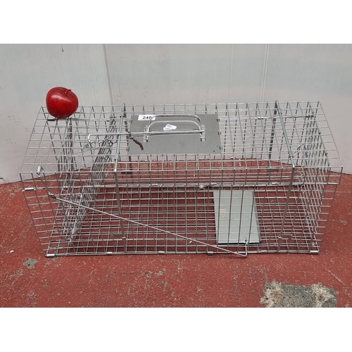 248 - A brand new metal wildlife trapping cage. Mm: L67cm x W24cm x H28cm As new.