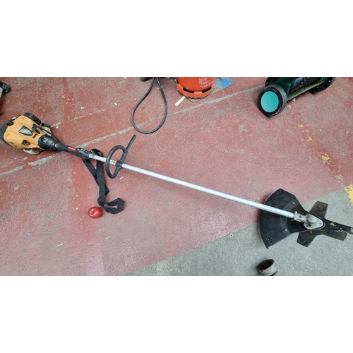 259 - A JCB grass strimmer with petrol engine in good working order.
