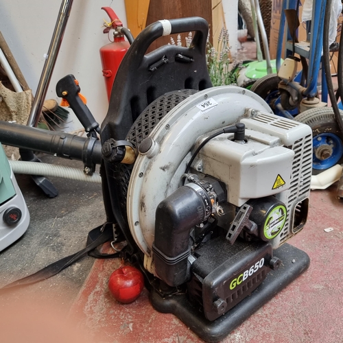 264 - A Gardencare GCB650 engine powered leaf blower with holster to strap on back.