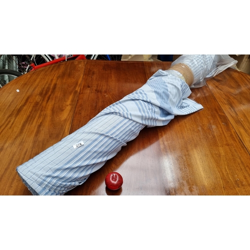278 - A very large bolt of pinstriped blue fabric, in a cotton blend.