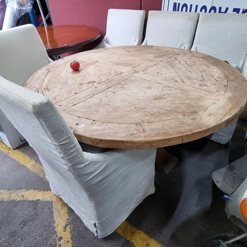 289 - Star lot: A large very heavy solid oak round dining table with contrasting figure to the top and a s... 