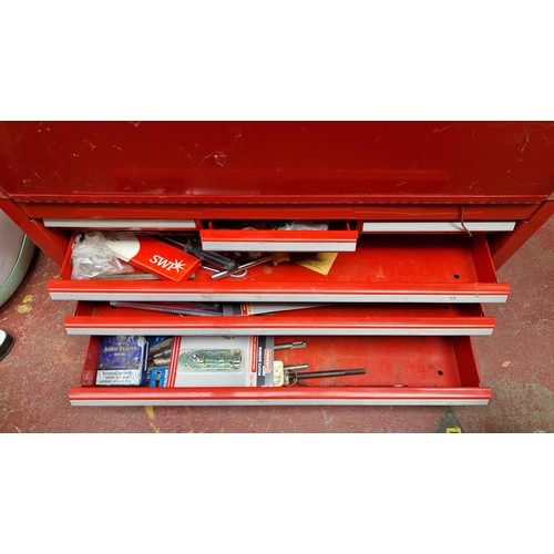 274 - A very large and heavy International lockable metal tool case or locker with a bright red metal fini... 