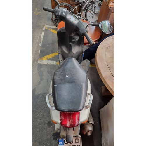 290 - A Yamaha 100 Neo Electric Start Moped. In a warm grey finish with kickstand, review mirrors and key.... 