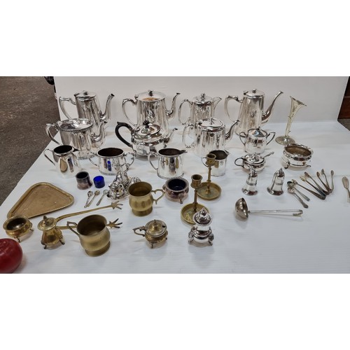 A wonderful collection of twenty eight EPNS and brass items including a very pretty mustard dish with lion's claw feet, heave coffee pot and teapot and a lovely pair of brass  candlesticks. Great condition! All looks to be recently cleaned.